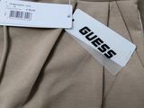 guess men ' s sweatpants in khaki with a tag on the side