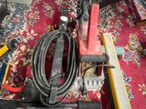 a picture of a vacuum and other tools on a carpet