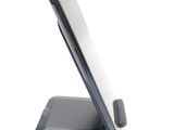a cell phone that is sitting on top of a stand