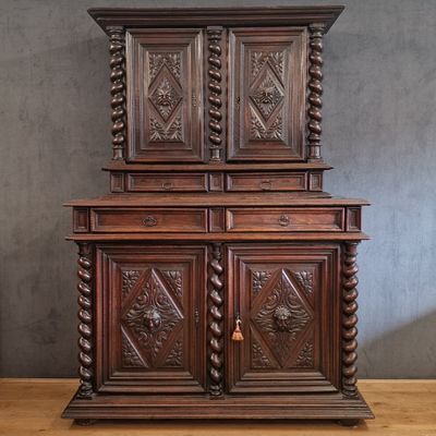 an old wooden cabinet with carvings and carvings on the doors