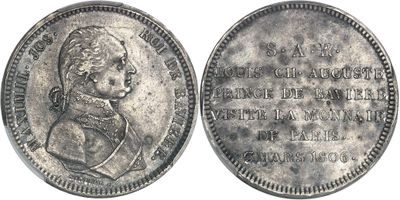 Gros plan sur une pièce de monnaie représentant une femme.