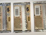 three packages of chocolate sitting on top of a table