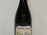 a bottle of wine that is sitting on a table