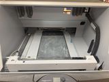 a machine that is sitting inside of a cabinet