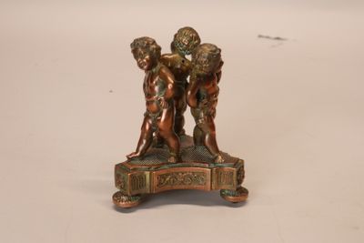 bronze figurine of three cherenshes on a marble base