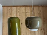 two lamps hanging from the ceiling in a room