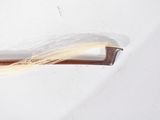 a wooden handle with a white cloth on it