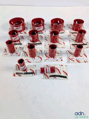 many red cups and a knife on a white table