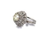 a close up of a diamond ring on a white background
