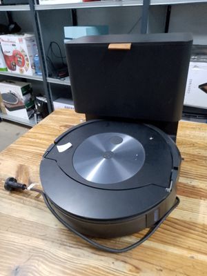a robot that is sitting on top of a wooden table