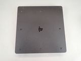 a metal plate with a logo on it on a white surface