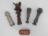 several different types of metal objects are displayed on a white surface