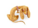 gold dog brooch with rubies and rubies on it ' s neck