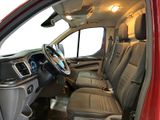 the interior of a red truck with leather seats and a steering wheel