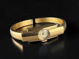 an image of a close up of a gold bracelet with a clock on it