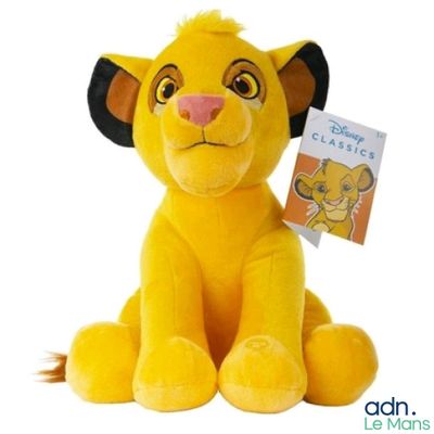 disney the lion cub plush toy sitting with a book in its mouth