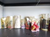 many different types of dolls on a shelf