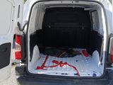 a white van with a bed in the back of it