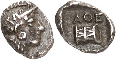 a silver coin with a picture of a man on it