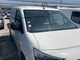 the white van is parked in the parking lot next to other cars