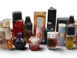 many different types of perfume bottles on a white surface