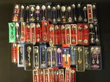 a lot of spoons and spoon spoons that are on display