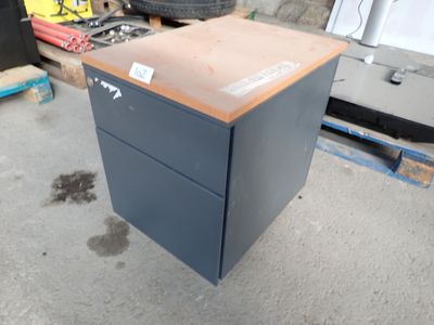 an image of a steel filing cabinet in a garage