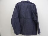 an image of a blue jacket hanging on a wall
