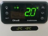 a digital clock on the wall showing the time