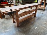 a workbench in a workshop with tools on it