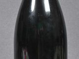 a bottle of wine that is sitting on a table
