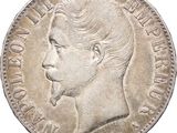Gros plan sur une pièce de monnaie portant le visage d'un homme