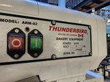 a white machine that has a red and green button on it