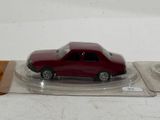 a red toy car sitting on top of a plastic tray