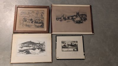 three framed pictures of a city and a river are on the floor