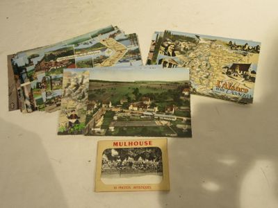 many postcards that are sitting on a table