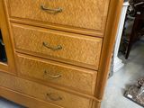 an image of a wooden dresser with drawers and a mirror