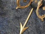 a close up of a metal object with an arrow on it