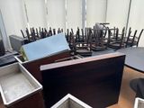 a room with a lot of chairs and tables in it