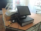 a computer sitting on top of a table in a room