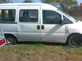 a white van that is parked in the grass
