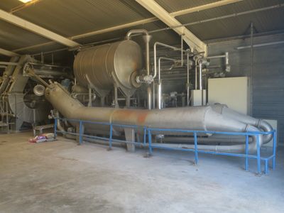 a large metal pipe in the middle of a building
