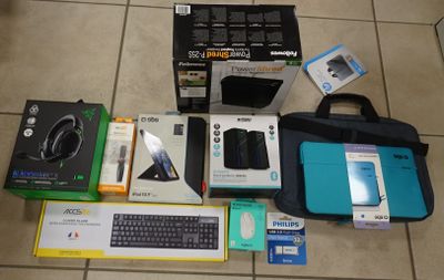 a lot of electronic items on the floor next to each other