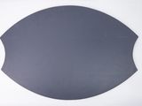 a close up of a black plate on a white surface