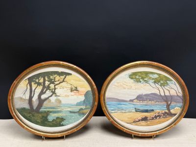 pair of framed paintings of a beach scene with trees and water