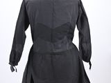 an image of a black dress on a mannequin stand