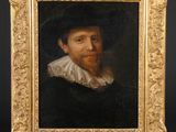 un tableau représentant un homme portant un chapeau noir et un col blanc