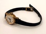 an image of a wrist watch with a black band on a white surface