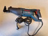 an electric drill with a cord attached to it sitting on a table