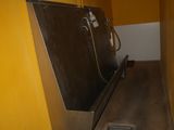a large metal object in the middle of a hallway